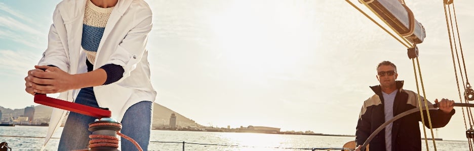 Image of a boat, couple and steering wheel for sea travel, retirement wealth and vacation investment hobby. luxury sailing, rich and fun marriage in the ocean or lake water with sunglasses outdoors in the sun