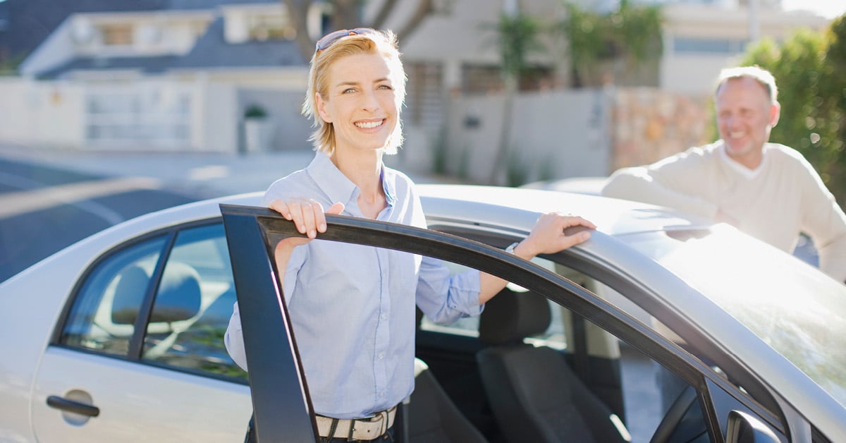 Image of a woman leaving her car